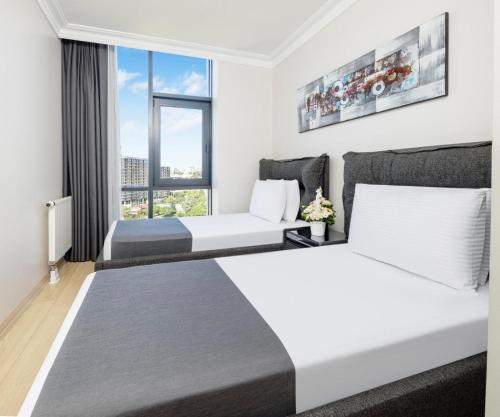 Ένα ή περισσότερα κρεβάτια σε δωμάτιο στο Mayar Residence Hotel