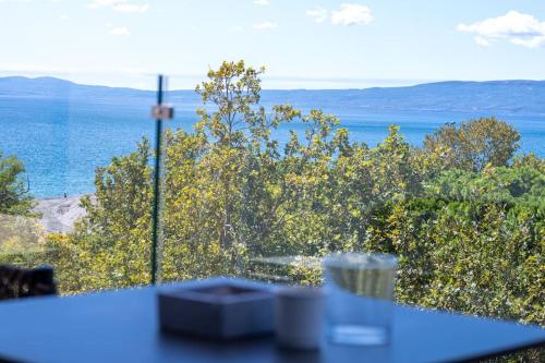 a view of the ocean from a table at KEDL Junior Suites in Kalamata