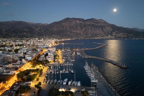an aerial view of a harbor with boats in the water at KEDL Junior Suites in Kalamata