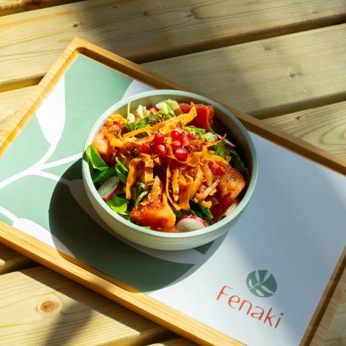 a bowl of food on a plate on a table at JOST Hostel Lille Centre in Lille