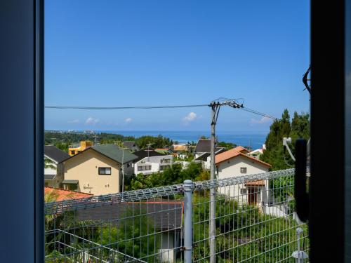 a view from a window of a city at SEA EIRENE Hillstop Onnason in Inbu
