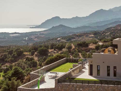 a house on a hill with a view at Hue Villa, Stunning Southern Beaches, By ThinkVilla in Asómatoi