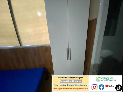 a white cabinet in a room with a window at Cabo Frio - Jardim Caiçara - Aluguel Econômico in Cabo Frio