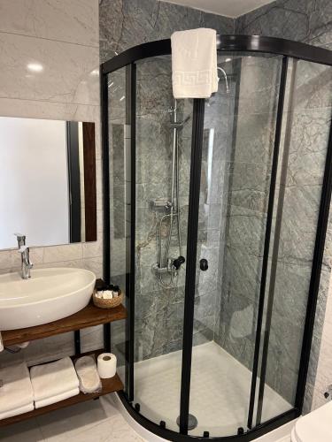 a bathroom with a shower and a sink at Dia Urla in Urla