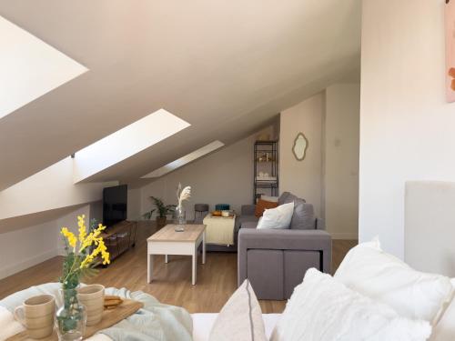a living room with a couch and a table at TiétarHomes 4A in Navalmoral de la Mata