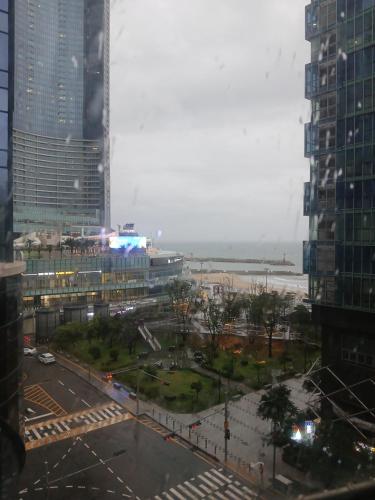 a view of a city street with tall buildings at 바다스테이 in Busan