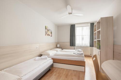 Posteľ alebo postele v izbe v ubytovaní myNext - Hotel Rudy