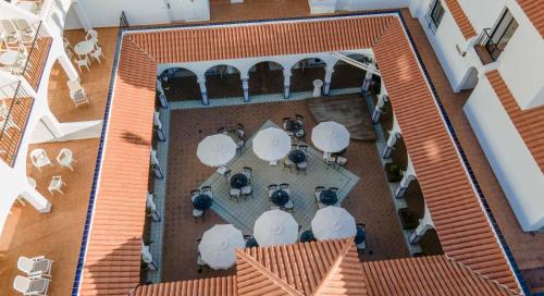 an overhead view of a patio with tables and chairs at Ona Beverly Hills Heights in Los Cristianos