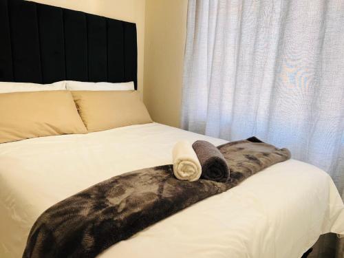 Postel nebo postele na pokoji v ubytování Modern Apartment in Randburg