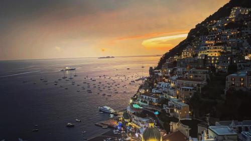a view of the amalfi coast at sunset at Amalfi House Marlidia in Conca dei Marini
