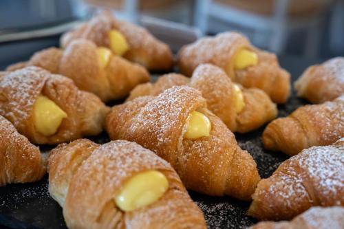 a bunch of pastries with sugar on them at Plaza Hotel Abano Terme in Abano Terme