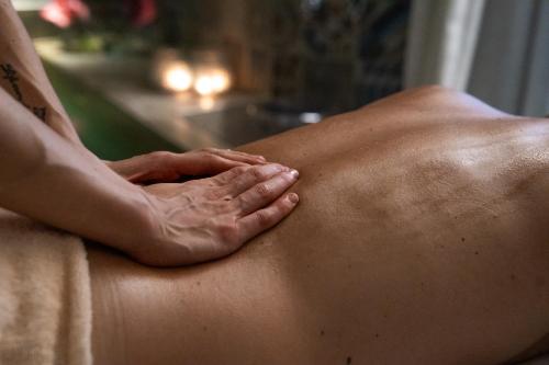 a man getting a massage in a towel at Plaza Hotel Abano Terme in Abano Terme