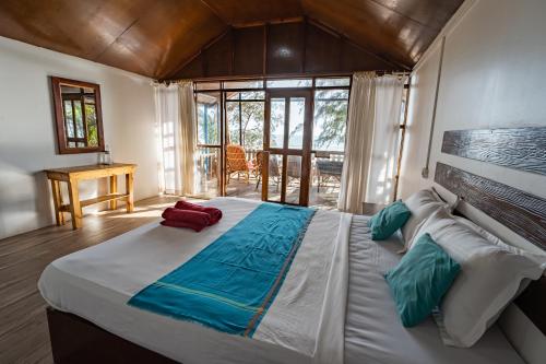 Postel nebo postele na pokoji v ubytování Peace Garden Beach Resort