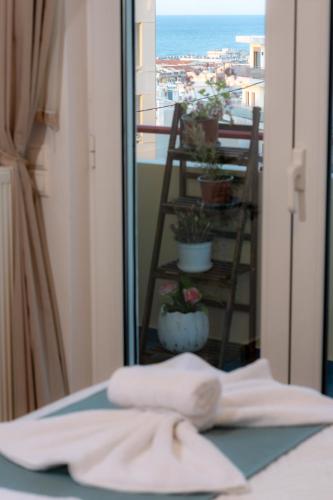 a hotel room with a view of a balcony at VDG Seafront Elegant Residence in Rethymno Town