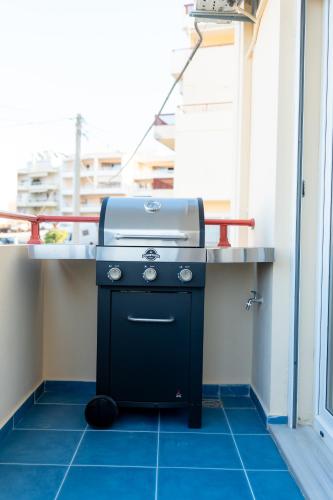 a grill sitting on the floor in a room at VDG Seafront Elegant Residence in Rethymno Town