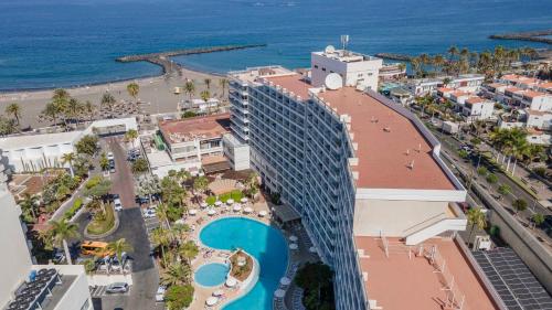 an aerial view of a hotel and the ocean at Ona Palm Beach in Playa de las Americas