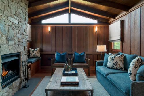 a living room with a couch and a fireplace at Spicers Hidden Vale in Grandchester