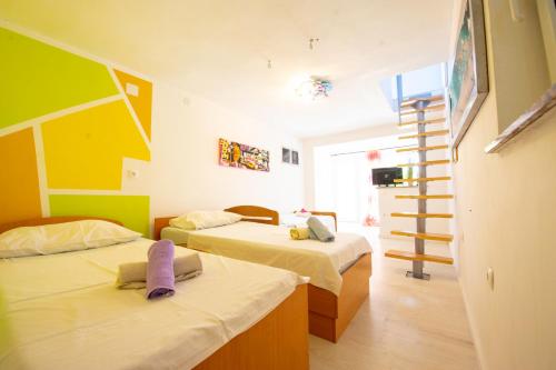 Postel nebo postele na pokoji v ubytování Apartments Claudia