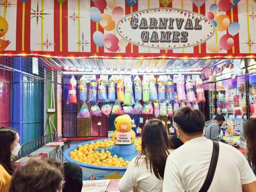 a group of people standing in a candy store at Mossy Forest Family Retreat II, 2-8 pax, Cameron Highlands in Cameron Highlands