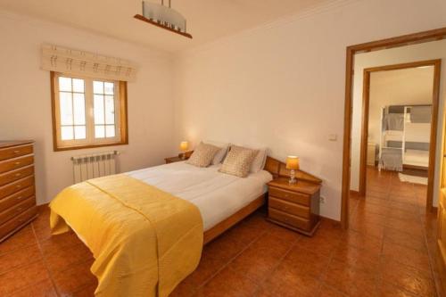 a bedroom with a bed and a large mirror at Vivenda Senhora das Areias in Aveiro