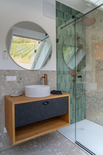 a bathroom with a sink and a mirror at steiRerBLiCke - Domaine Sernau Sauvignon in Gamlitz
