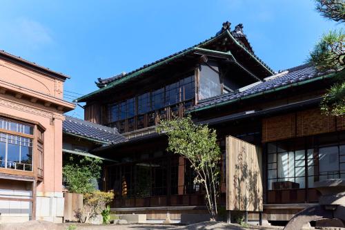 a building with windows and a roof at Hariso in Sendai