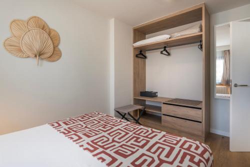 Ένα ή περισσότερα κρεβάτια σε δωμάτιο στο Hotel LIVVO Anamar Suites