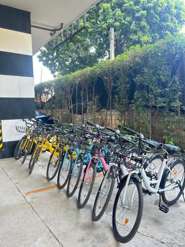 a row of bikes parked next to each other at The Bridge Residence Hotel in Kanchanaburi