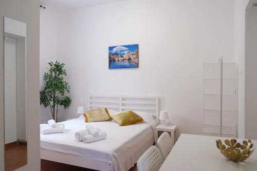 Ένα ή περισσότερα κρεβάτια σε δωμάτιο στο Suites Riccò