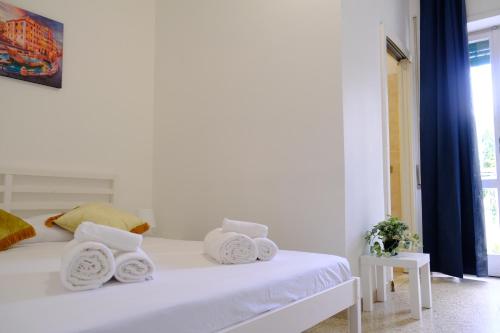 Ένα ή περισσότερα κρεβάτια σε δωμάτιο στο Suites Riccò