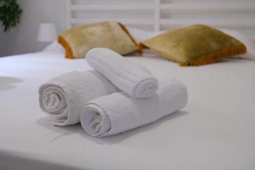 Ένα ή περισσότερα κρεβάτια σε δωμάτιο στο Suites Riccò