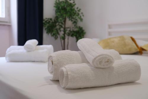 Ένα ή περισσότερα κρεβάτια σε δωμάτιο στο Suites Riccò