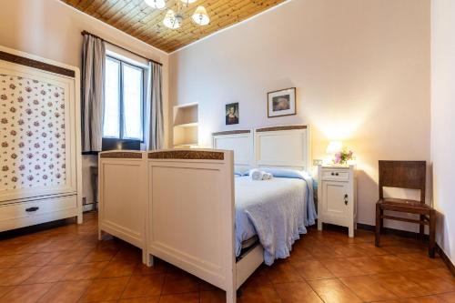 a bedroom with a bed and a window at Cascina Gaggioli in Milan