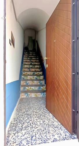 a hallway with stairs in a building with a door at Vasto House in Vasto