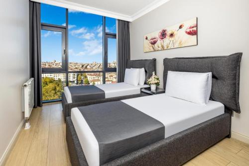 Ένα ή περισσότερα κρεβάτια σε δωμάτιο στο Mayar Residence Hotel