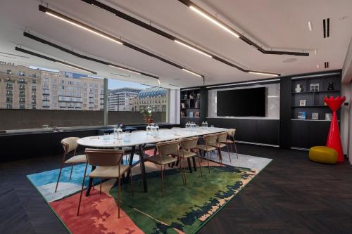a conference room with a long table and chairs at Cardo Brussels, Autograph Collection in Brussels