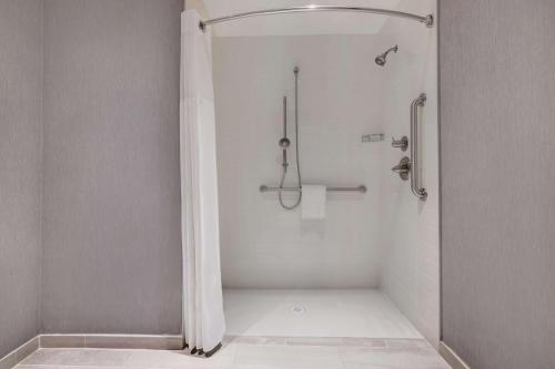 a bathroom with a shower with a shower curtain at Hyatt Place Flagstaff in Flagstaff