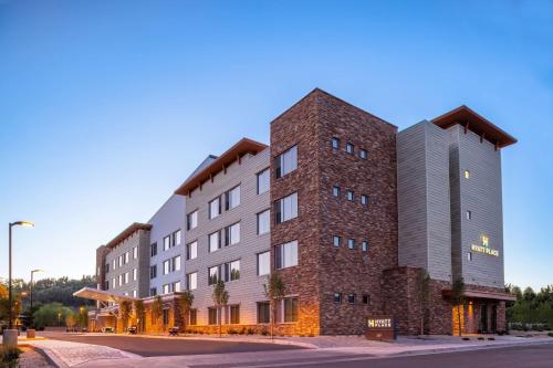 a rendering of a hotel with a brick building at Hyatt Place Flagstaff in Flagstaff