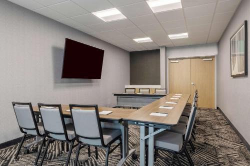 a conference room with a wooden table and chairs at Hyatt Place Flagstaff in Flagstaff
