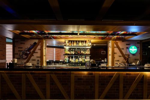 a bar with a lot of liquor bottles at Olive Downtown in Cochin
