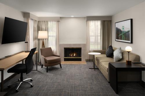 a living room with a couch and a fireplace at Residence Inn Portland Hillsboro in Hillsboro