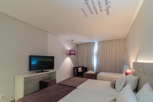 Postel nebo postele na pokoji v ubytování Costa de Prata Hotel