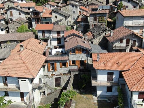 an aerial view of a village with houses and roofs at Naturstein-Rustiko Casa Marie in Vercana