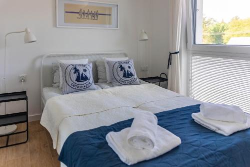Postel nebo postele na pokoji v ubytování Apartament Morze, Klimat i Klimatyzacja by TriApart