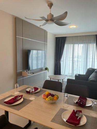 a living room with a table with fruit on it at Suasana Suites Johor Bahru City Centre in Johor Bahru