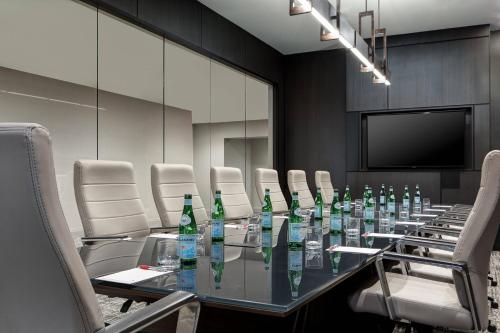 a conference room with a long glass table and chairs at Odessa Marriott Hotel & Conference Center in Odessa