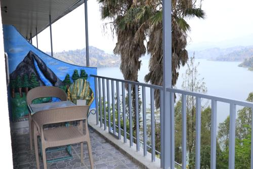 a balcony with a view of the water at Home Saint Jean Ltd in Gitesi