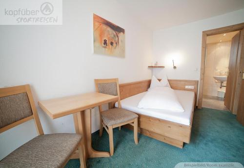Postel nebo postele na pokoji v ubytování Alpenperle