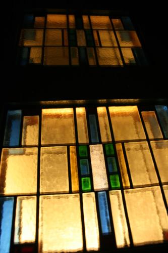 a stained glass window in front of a building at Casa Lucinda in Ghent