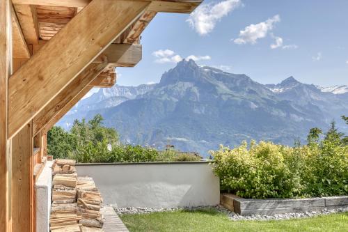 a house with a view of the mountains at Chalet Monte Bianco I Luxe I Bain nordique I Sauna in Combloux